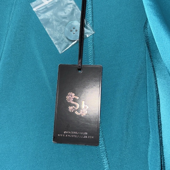 Size 12 blazer (color) Teal
Size 12 tutu skirt (color) Teal - Picture 3 of 3